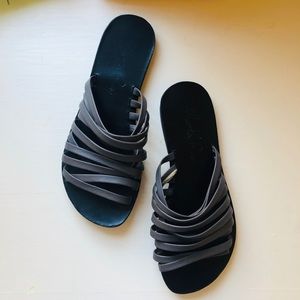 Black and grey Italian leather sandals.